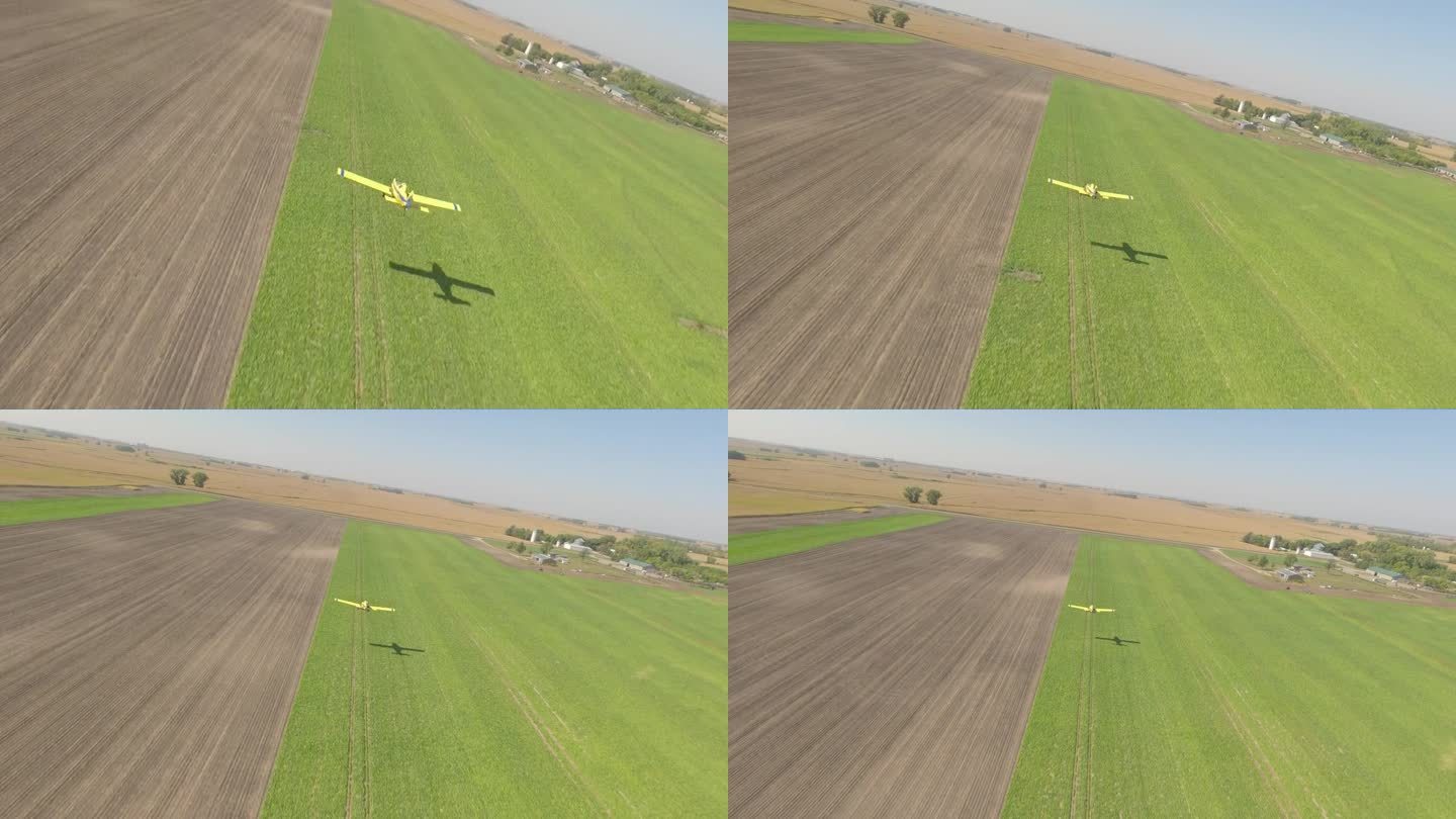 FPV无人机捕获的小型作物喷粉机在农村草地跑道的低空飞行