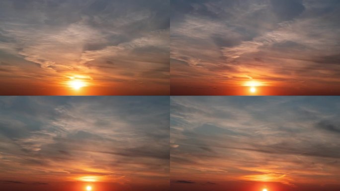 时间流逝。夕阳把天空中的云染成不同的颜色，从橙色到紫红色