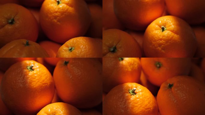 橙色水果。镜头慢慢向上移动，显示阴影中的橘子，阳光美丽地照在橘子上。特写镜头