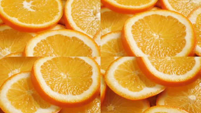 橙色水果。镜头慢慢向下平移，显示新鲜多汁的切片橙子的微距镜头