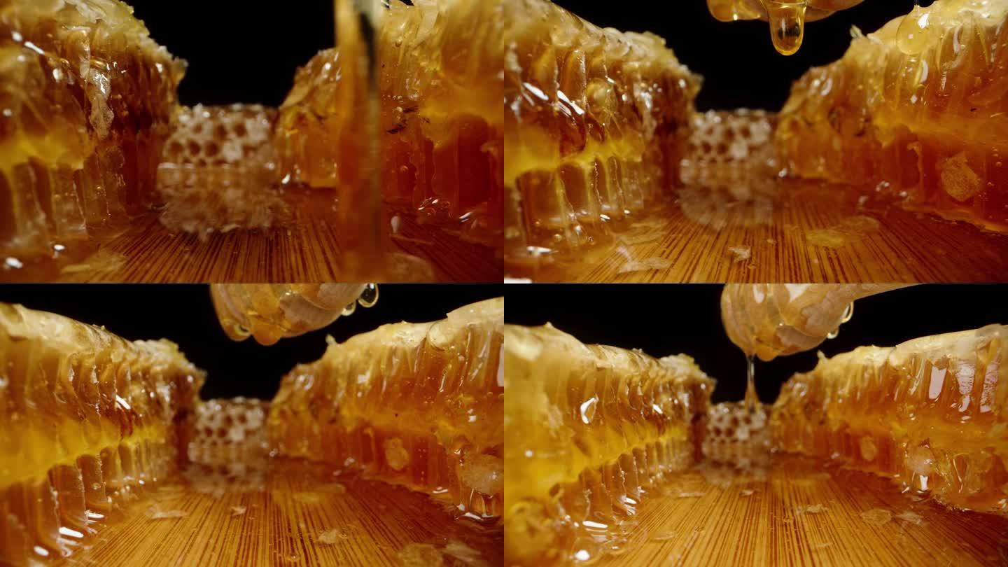 蜂蜜从蜂巢里滴到木桌上，从勺子上掉下来，相机从下面经过。多莉滑块极端特写。