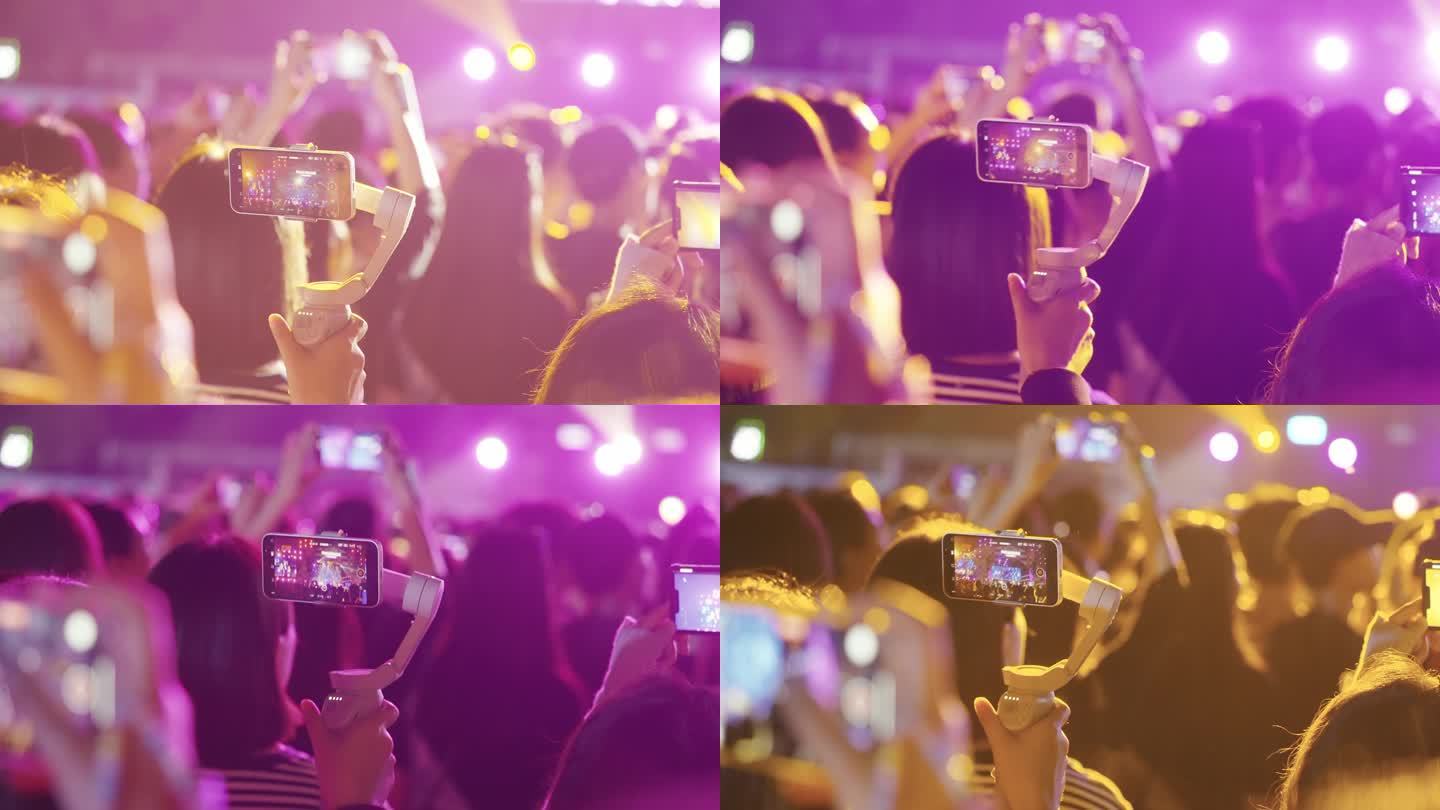 音乐节演唱会手机拍摄视频的歌迷