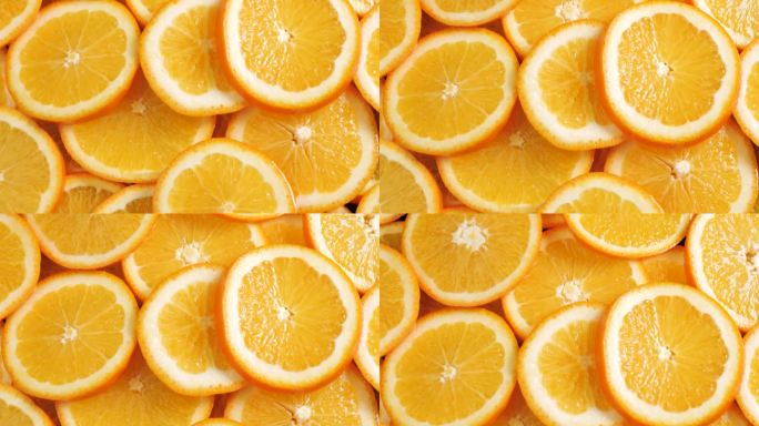 橙色水果。镜头向上移动，显示了许多切片的橙子。特写镜头