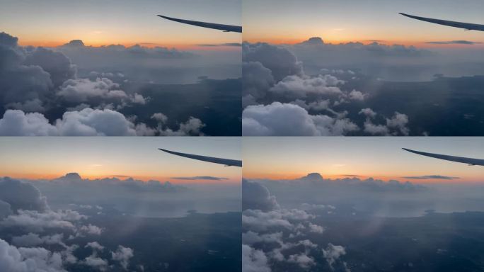 飞机在日落时分飞过一群云