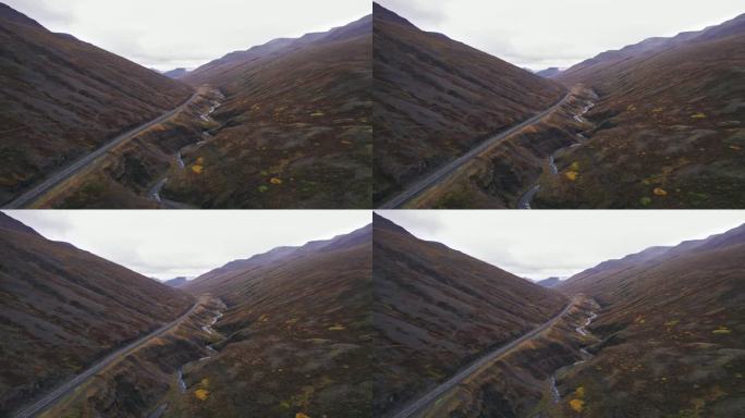 空中:冰岛环城公路上没有汽车的空旷道路，这是一条风景秀丽的高速公路，穿过风景如画的偏远峡湾地区，导致