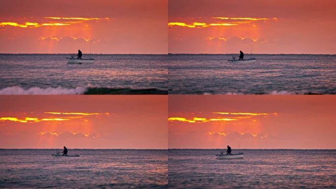 平静的海水渔民，新鲜的鱼在网和渔船的轮廓对日出天空的云与阳光射线视频