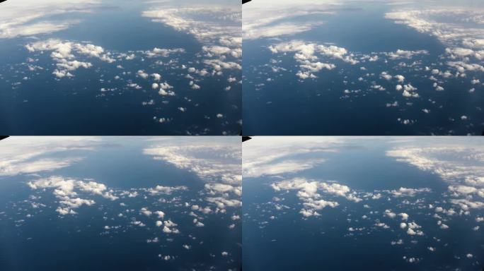 从宇宙飞船或飞机窗口鸟瞰地球。从绕地球运行的宇宙飞船上俯瞰地球上的云和海洋，呈现电影般的慢动作。
