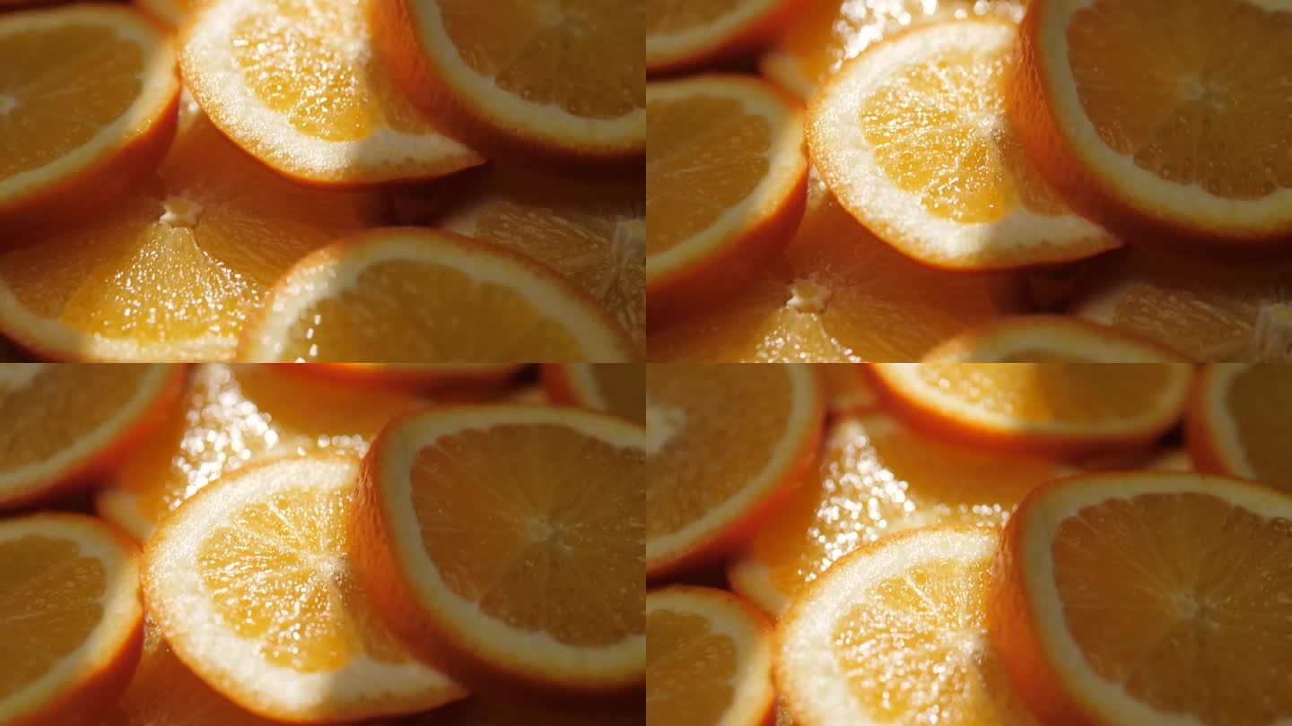 橙色水果。镜头缓慢移动，显示出阴影中切片的橙子，阳光照射下的橙子。微距镜头