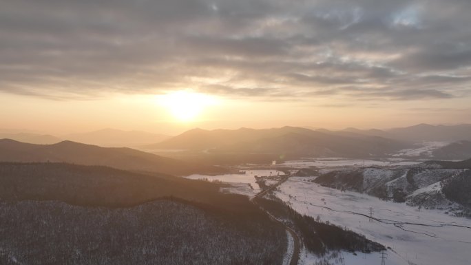 航拍寒冬山区山林雪景暮色