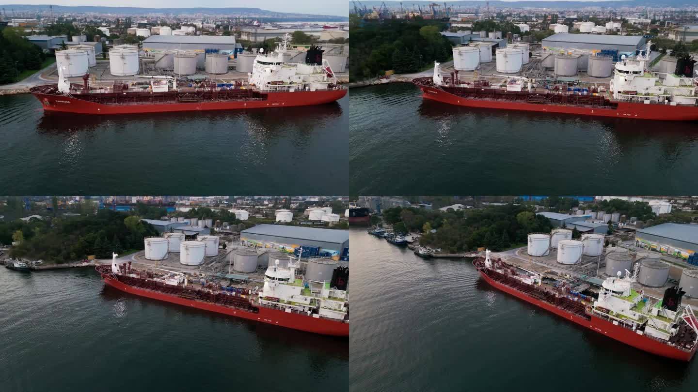 航拍图，油轮在码头加油，港口有储油库