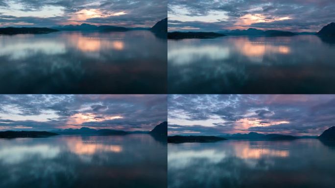 挪威峡湾五彩缤纷的日落和倒影。山的背景，无人机的时间流逝。
