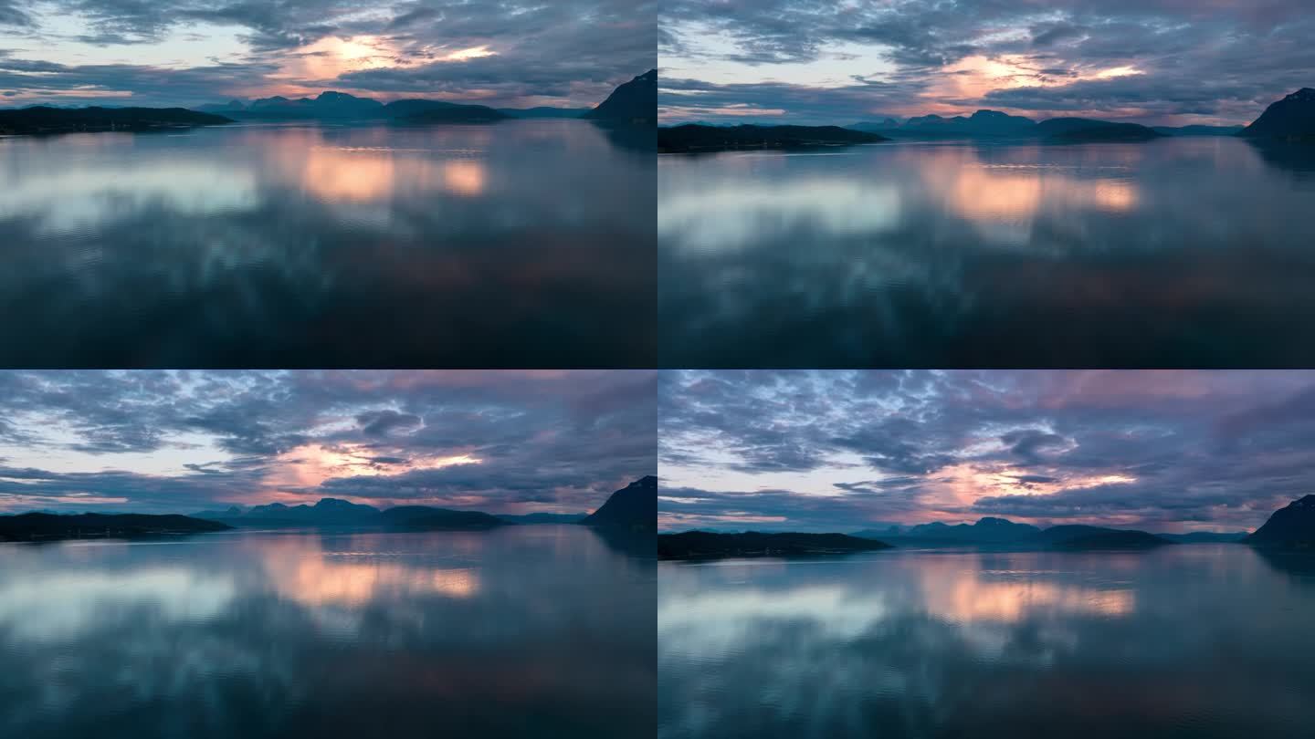 挪威峡湾五彩缤纷的日落和倒影。山的背景，无人机的时间流逝。