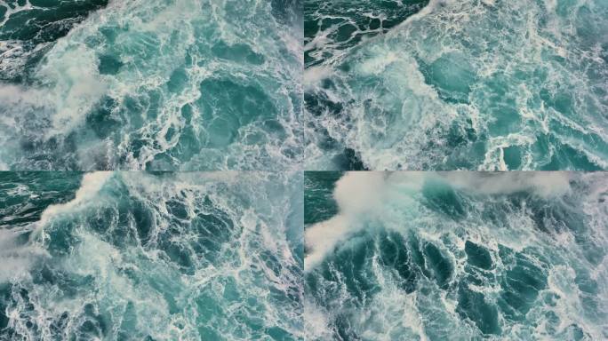 空中俯瞰的海洋风暴海浪。大海的海浪与白色的泡沫和蓝色的水。慢镜头，4K