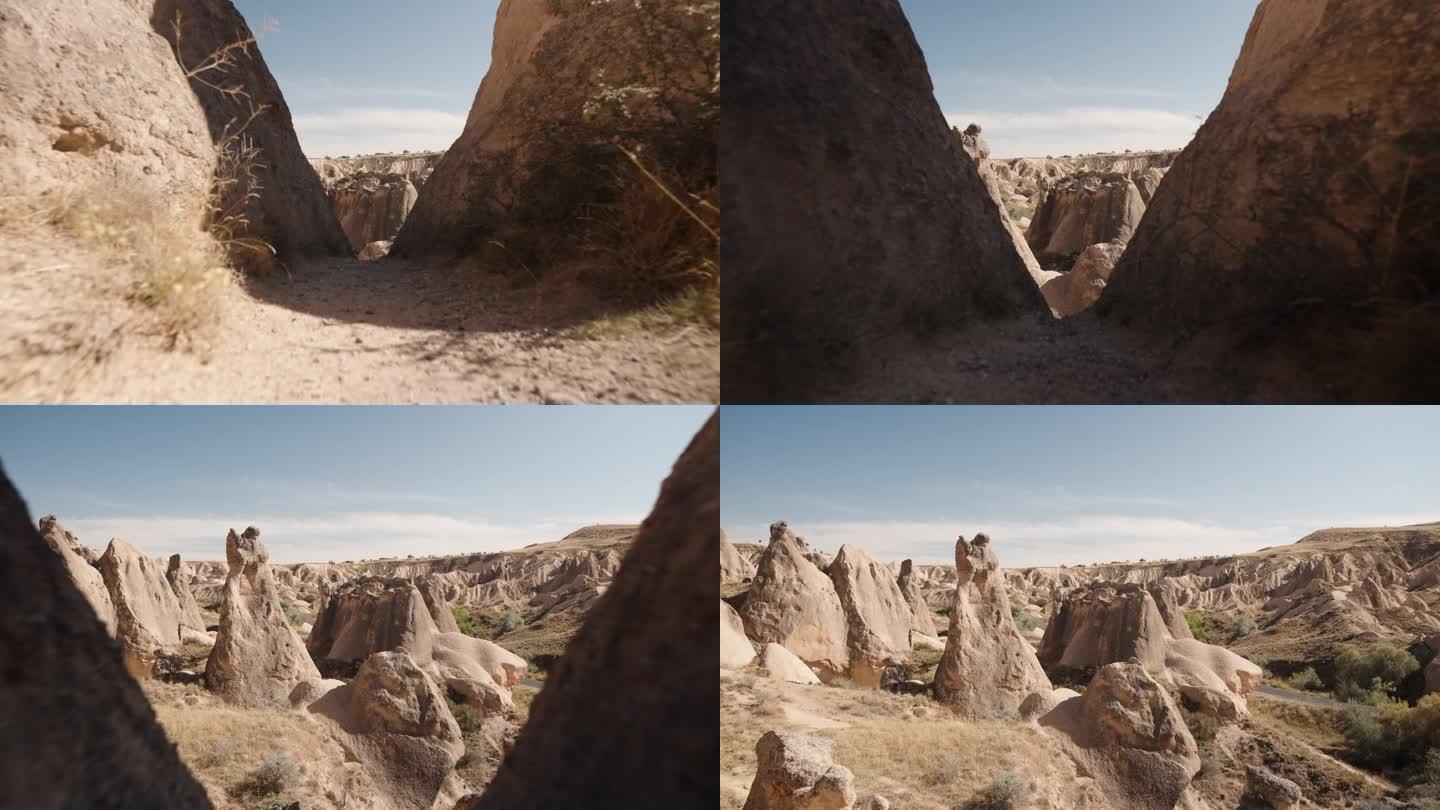 摄像机穿过岩石之间的峡谷，展现了想象谷中古老石头的景象。