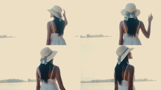 穿着白色连衣裙的时尚女子探索麦岛海滩