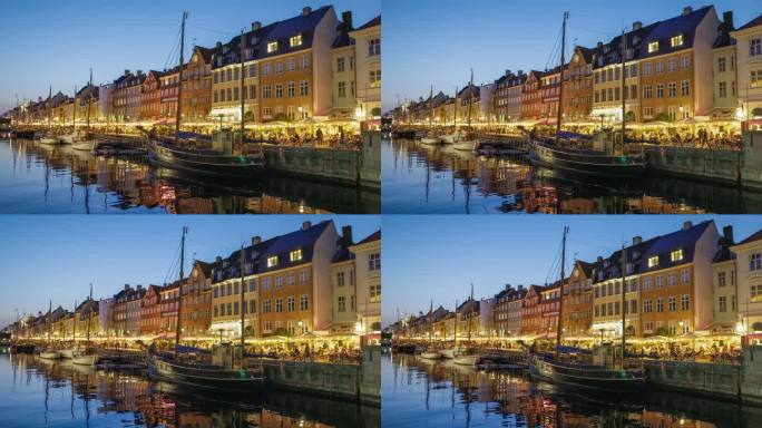 丹麦哥本哈根，4K HDR拍摄。哥本哈根新港的夜景，有五颜六色的房子和帆船
