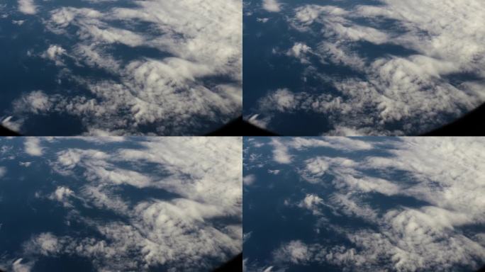 从宇宙飞船上鸟瞰地球。从绕地球运行的宇宙飞船上俯瞰地球上的云和海洋，呈现电影般的慢动作。