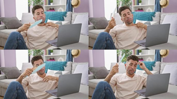 热的问题!年轻、专注的西班牙裔男子坐在客厅地板上，一边用手扇，一边在笔记本电脑上上网，满头大汗。