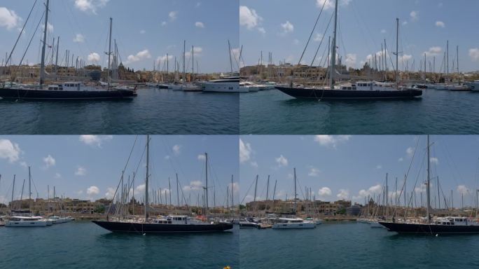一个有浮船坞和各种船只的码头的滑动镜头