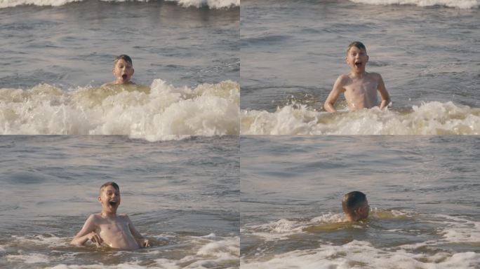 男孩在海里玩耍外国人海边游泳视频素材