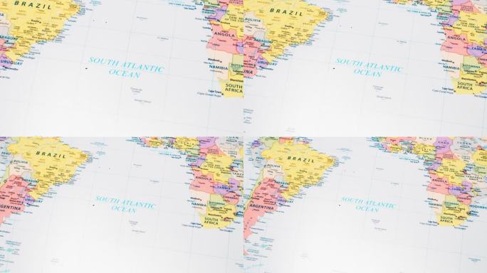 世界地图上“南大西洋”一词的特写，并附有首都的详细名称。相机变焦。