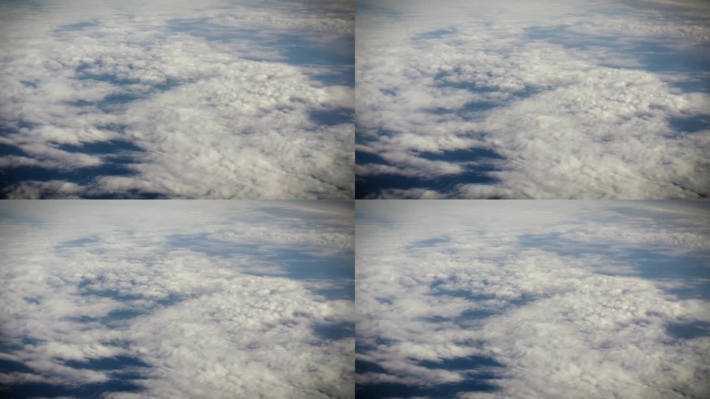 从飞机窗口鸟瞰地球。在地球上空飞行的飞机上，以电影般的慢动作俯视着大西洋上空蓬松的风暴云。