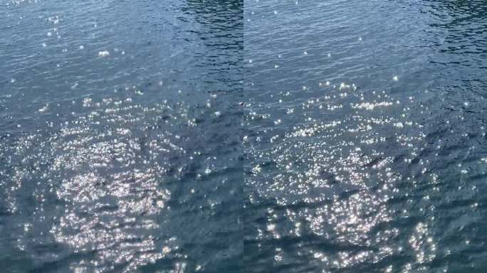 碧海粼粼水面，垂直视频。