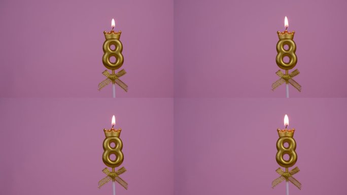 金色的生日蜡烛燃烧在粉红色，8号。