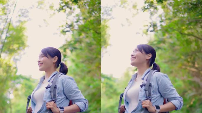 在山上徒步旅行的亚洲妇女