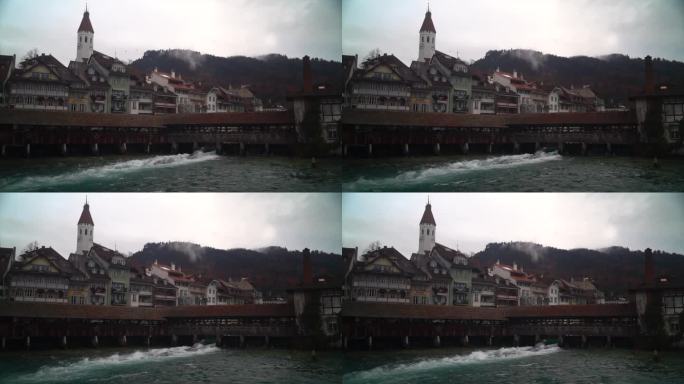 电影图恩河冲浪多云市中心历史悠久的瑞士瑞士小镇城堡施洛斯堡因特拉肯图恩湖宁静的锁冬天鸟飞三脚架仍然