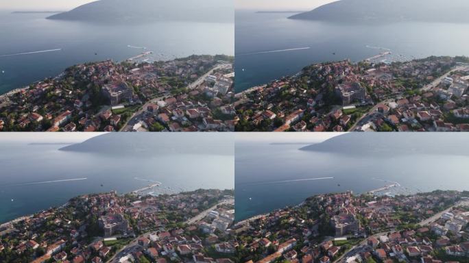 阳光亲吻Herceg Novi依偎在亚得里亚海，在现代黑山。——空中