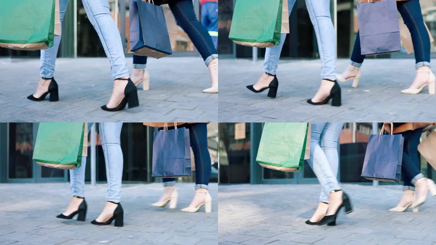 一名女子拖着双腿，拎着购物袋走在旧金山的大街上，购买名牌服装、时装特卖或旅行礼物。零售，人们和城市街