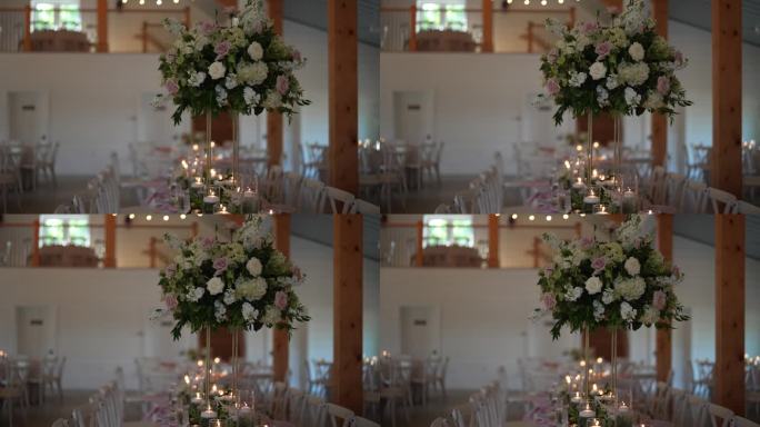 为婚宴精心安排的长桌设置，装饰着精致的蜡烛，鲜花和所有细节，营造出浪漫和时尚的氛围。