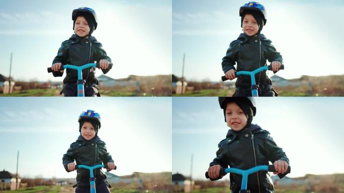 可爱的小男孩戴着安全帽，在阳光明媚的日子里学习骑第一辆平衡自行车。快乐的男孩骑着自行车，在日落时分在