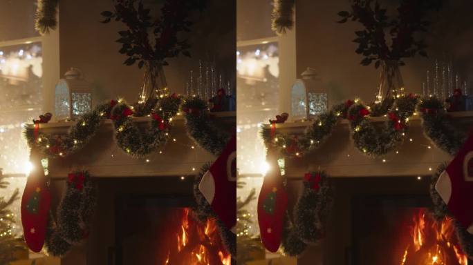 垂直屏幕:温暖的气氛在一个冬天下雪的夜晚:空的家庭内部与壁炉装饰的圣诞树，礼物，装饰品，花环和长袜。