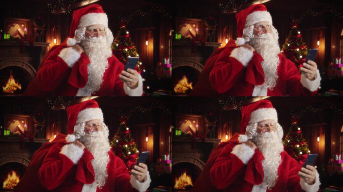 快乐的圣诞老人，白色毛茸茸的胡子和红色的服装正在使用智能手机。接受来自世界各地所有好孩子的在线礼物订
