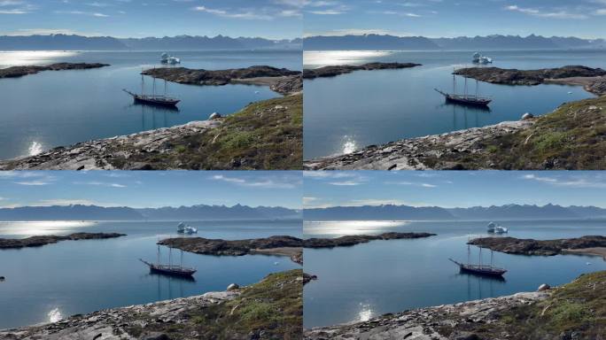 从丹麦岛的高地到三桅纵帆船停泊的海湾的美丽全景。Scoresbysund,格陵兰岛。