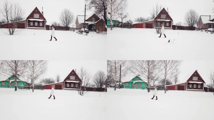 人黄帽走桦木老木绿棕色的房子冬天下雪