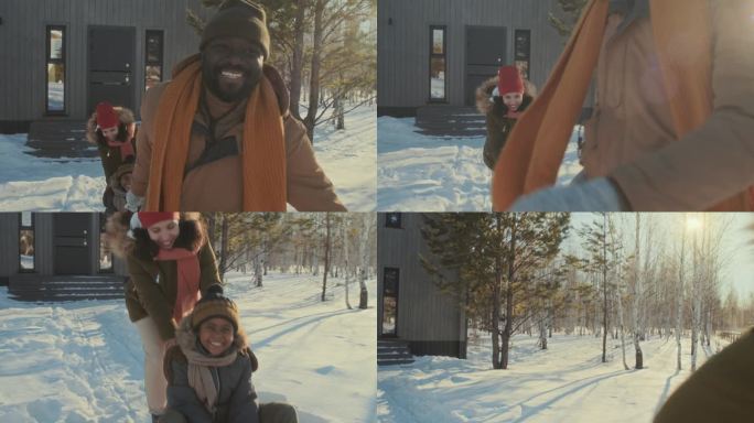 冬日里，孩子和父母一起滑雪橇
