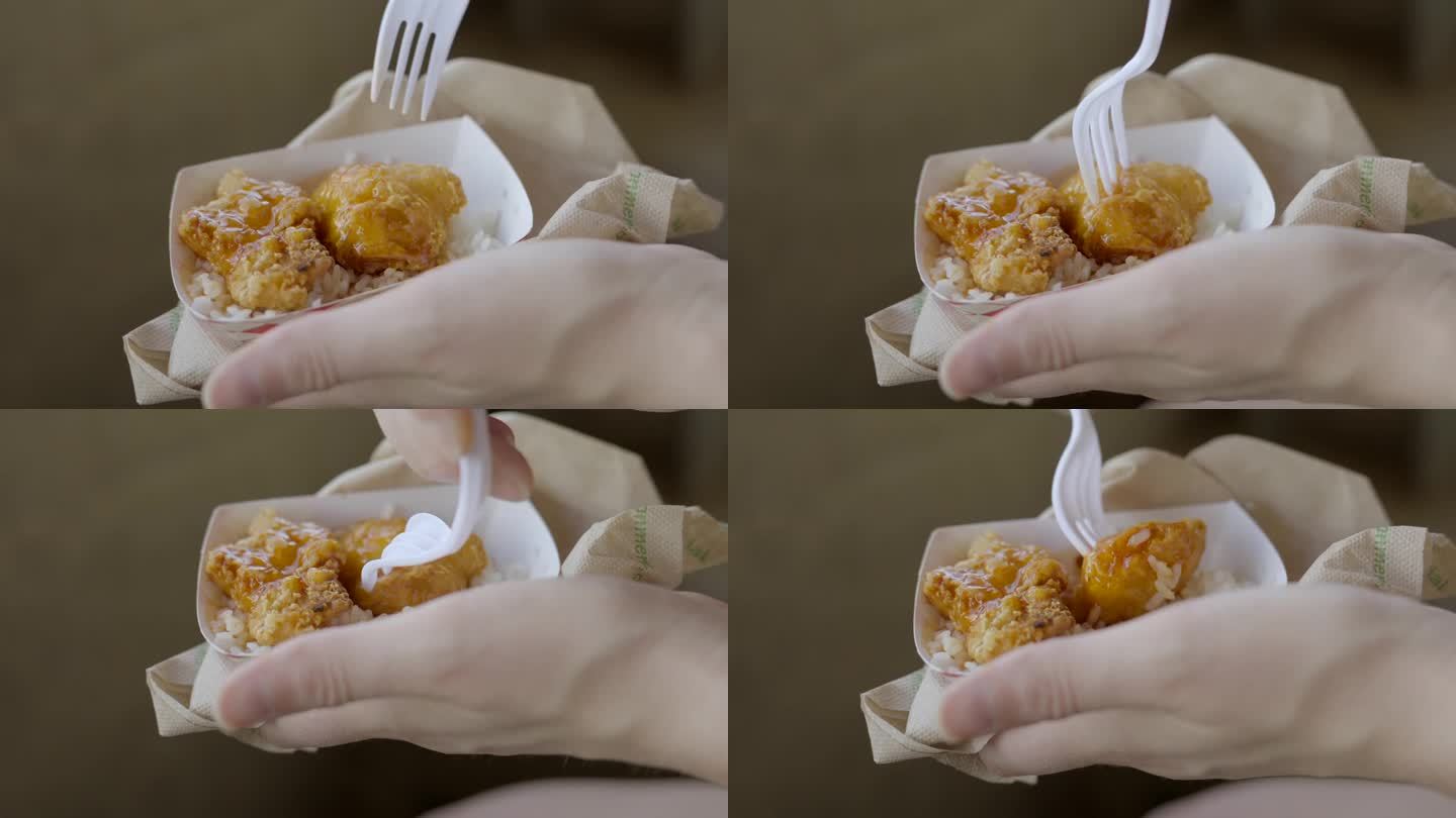 叉子挑橙色的鸡肉小吃