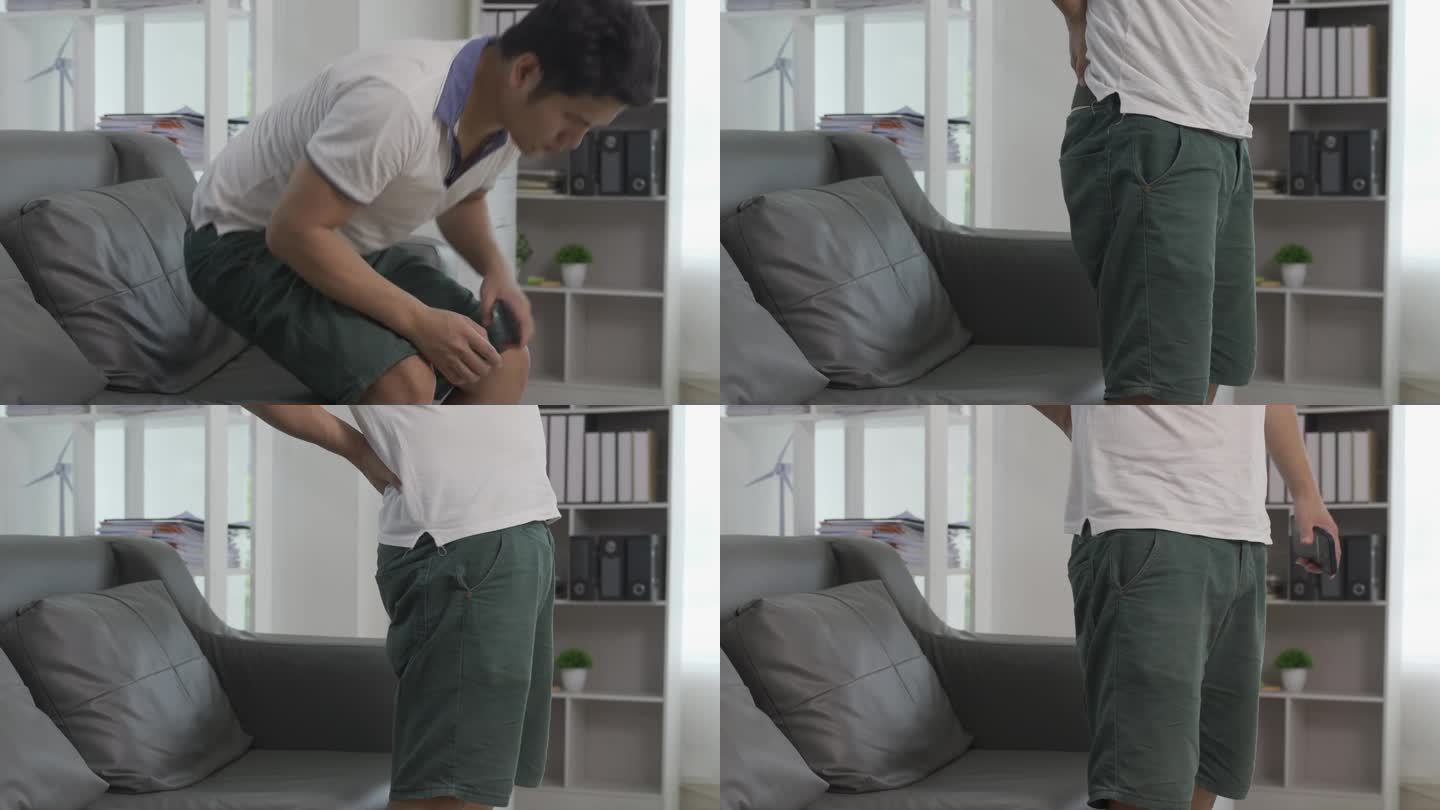 年轻的亚洲男子肌肉疼痛在他的手臂，腿和膝盖，感觉疼痛在他的肘部，肌肉疼痛保健概念