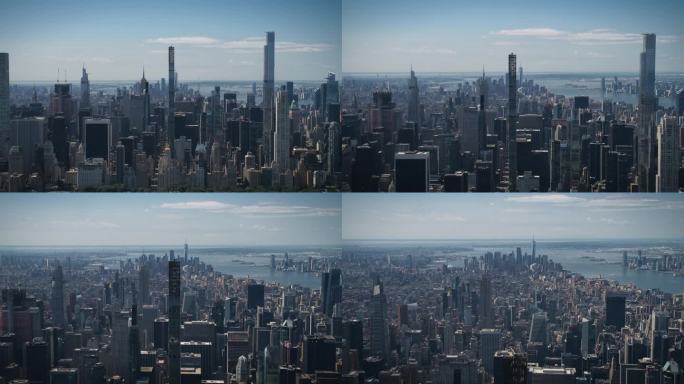阳光明媚的纽约，从空中俯瞰中央公园和曼哈顿中城的摩天大楼。电影无人机视角的城市天际线与略多云的蓝天