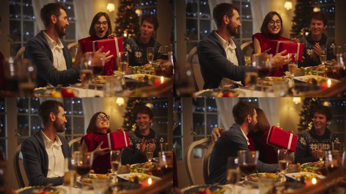 在家里与多元文化的亲人一起庆祝圣诞夜，享受火鸡晚餐。帅气的男友送给他美丽快乐的女友一份节日礼物