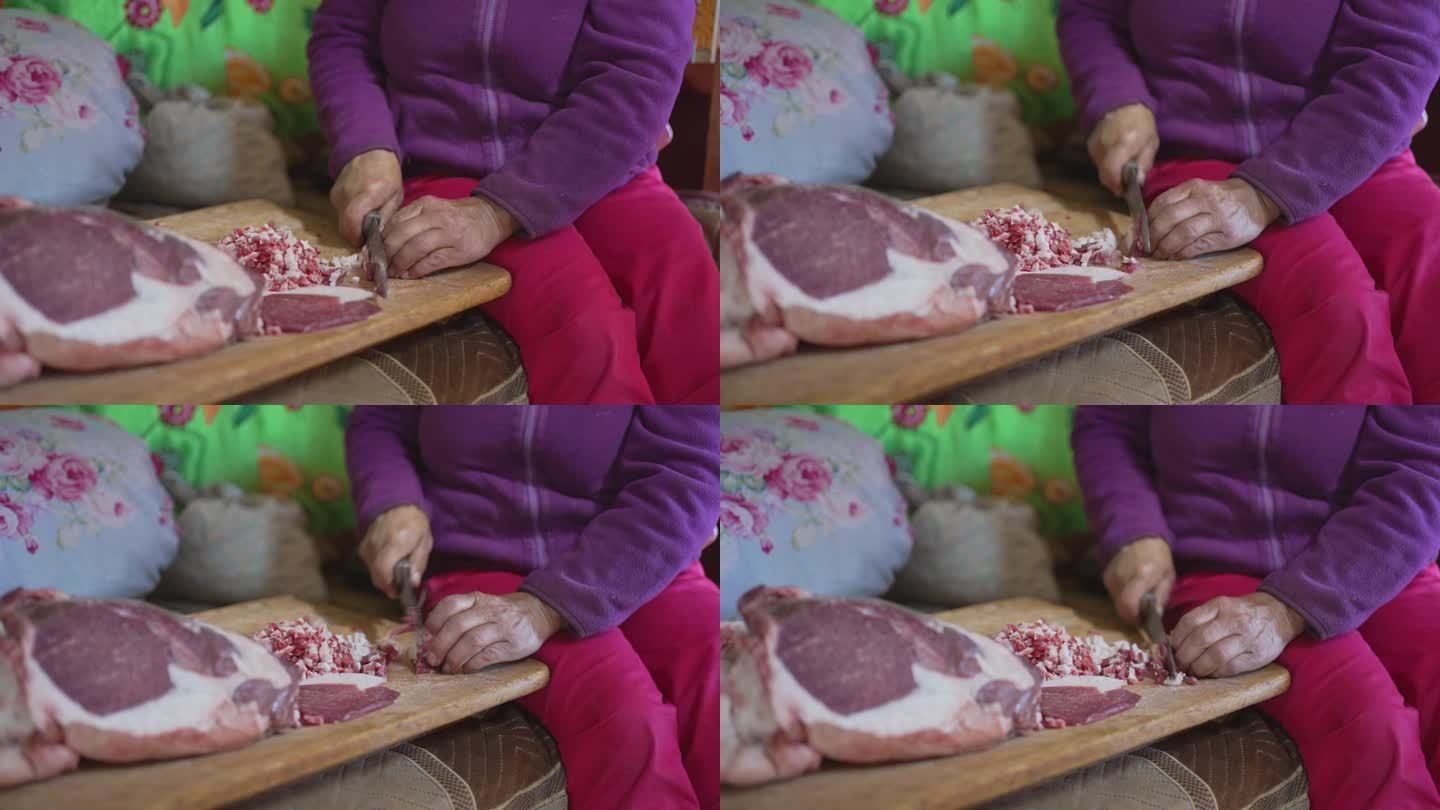 蒙古妇女切羊肉准备布兹