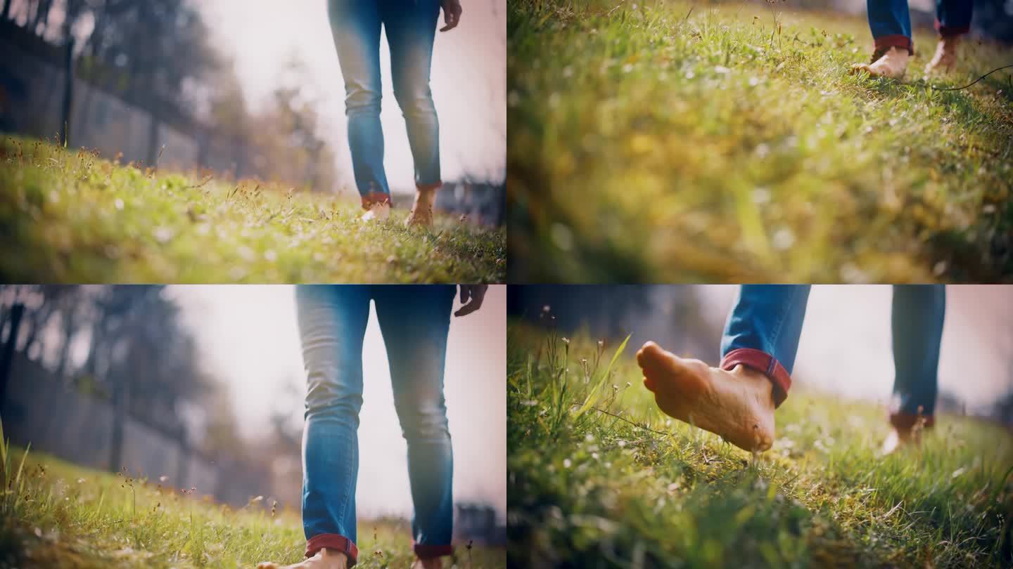 近距离的赤脚女人走在阳光明媚的草地上