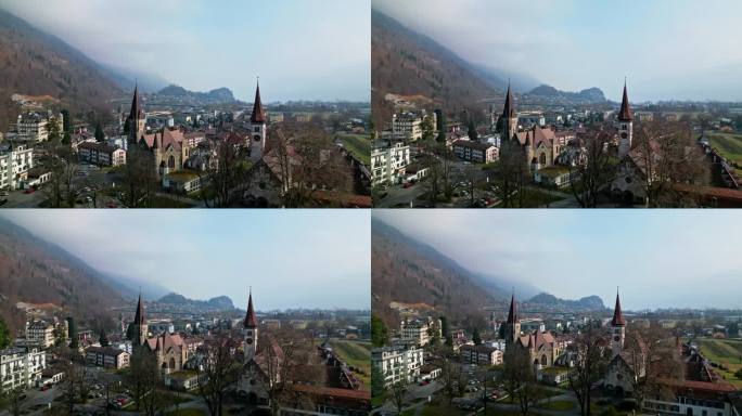 空中回拉离开大教堂和教堂的看法因特拉肯瑞士的家蔓延在远处