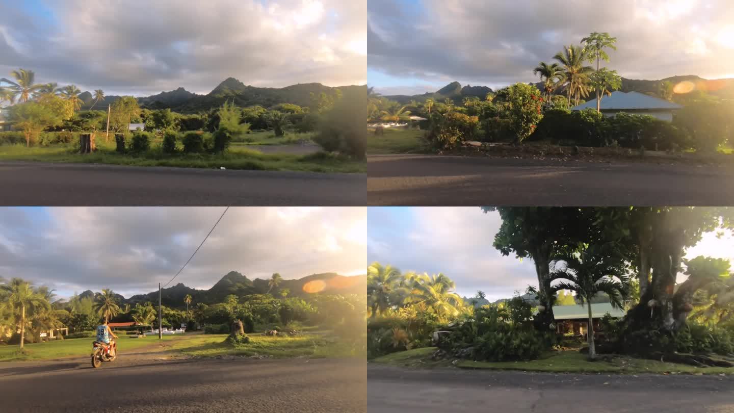 库克群岛拉罗汤加- 2020年6月5日:在多云的日落时分，阳光普照，远处的西侧街景和当地社区商店可以