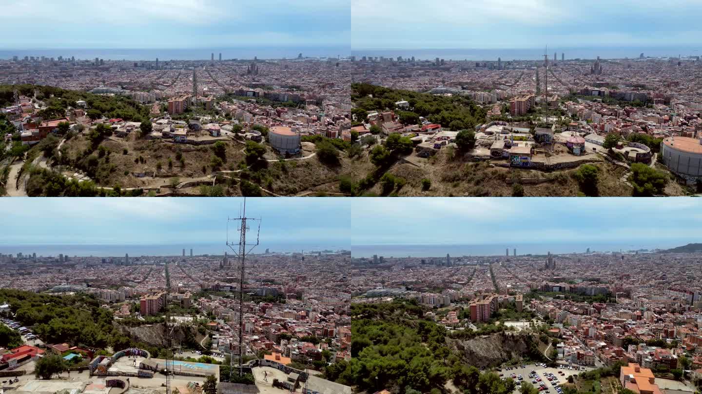 电影般的广角空中无人机拍摄巴塞罗那市，街景和远处的圣家堂标志性塔。