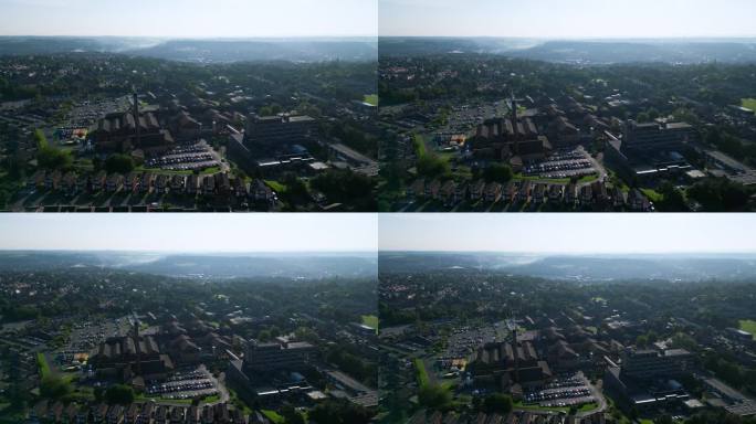 航拍画面展示了英国斯坦克利夫的工业建筑、充满活力的街道、杜斯伯里综合医院和夏季早晨的约克郡景观。