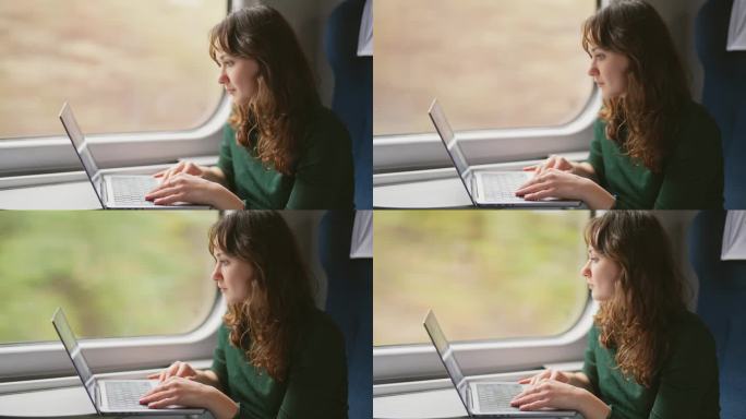 坐火车旅行时用笔记本电脑工作的女人